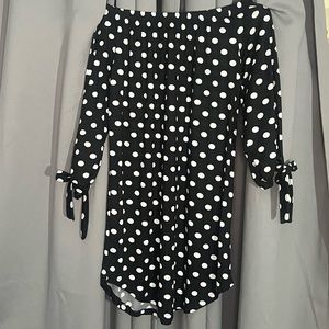 Large black dress with white polkadots.